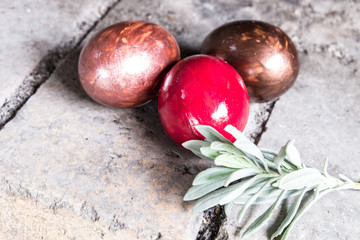 Easter eggs  with rosemarry on stone background