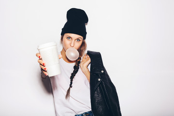 swag girl  with cup of coffee and looking at camera