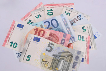 Euro notes on a plain white background.