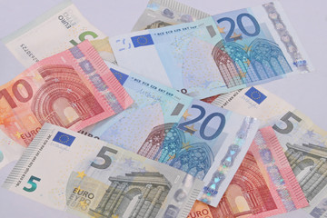 Euro notes on a plain white background.