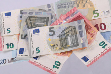 Euro notes on a plain white background.