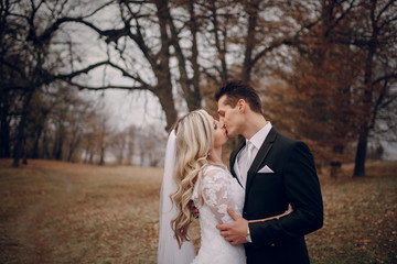 bride walking in golden autumn nature