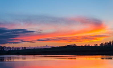 Beautiful lake with colorful sunset sky. 