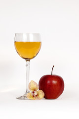 Still-life with an apple and a glass of juice