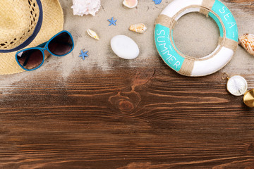 Travel accessories on wooden background