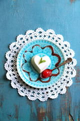Tasty panna cotta dessert on plate, on wooden table