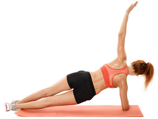 Fototapeta na wymiar Woman doing exercises on a mat