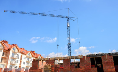 Construction site with crane against blue sky