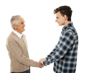 Grandfather and grandson shaking hands