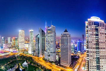 Naklejka premium urban skyline and illuminated skyscrapers