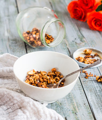 homemade granola with nuts and dried fruits, flowers