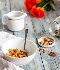 homemade granola with nuts and dried fruits, flowers
