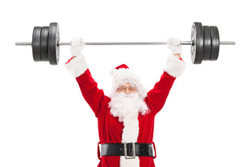 Smiling Santa Claus lifting a heavy barbell