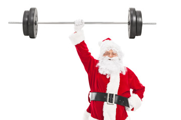 Smiling Santa holding a heavy barbell in one hand and looking at