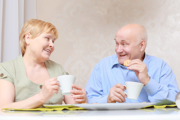 Couple drinks tea at home