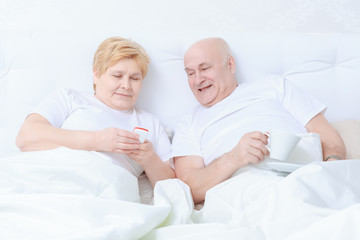 Couple interacts in bed