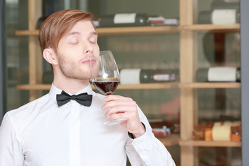Sommelier testing red wine