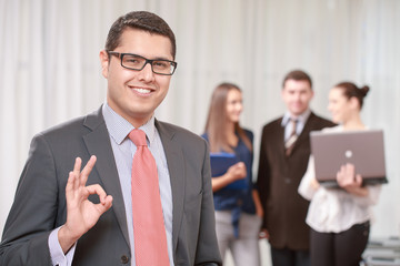 Fototapeta premium Businessman with a team at the meeting