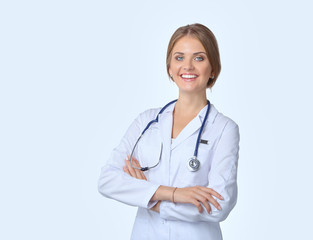 Portrait of young woman doctor with white coat standing in