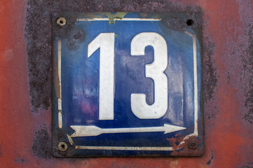 Weathered enameled plate number 13