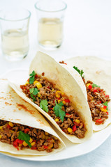 tacos with meat, corn and peppers