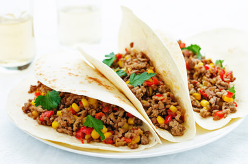 tacos with meat, corn and peppers