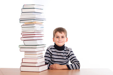 Schoolboy and a heap of books