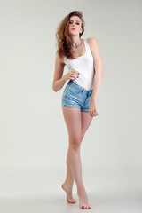 Studio shot of leggy model posing at camera