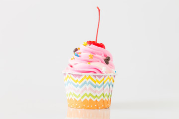 Colorful Cupcakes with icing and chocolate on white background