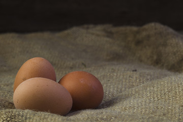Eggs on sackcloth background