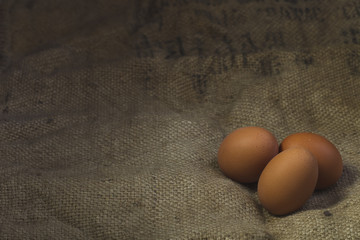 Eggs on sackcloth background