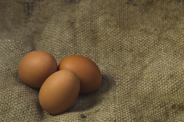Eggs on sackcloth background