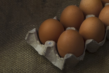 Eggs on sackcloth background