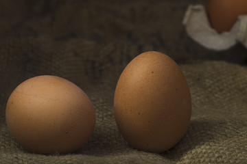 Eggs on sackcloth background