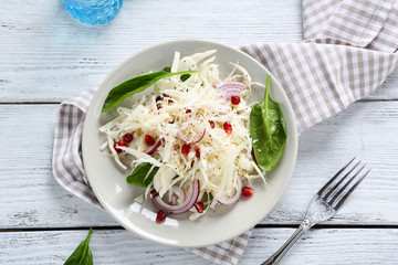 Salad with cabbage, onions and grenade