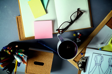 Designer's table with notes and tools