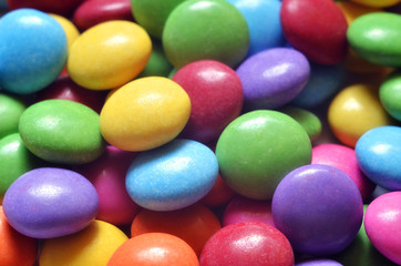 Macro detail of pile of colored smarties