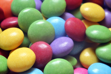 Macro detail of pile of colored smarties