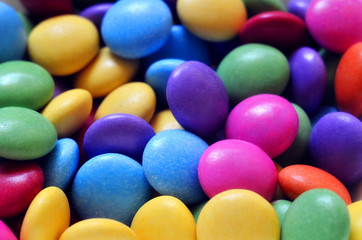 Macro detail of pile of colored smarties