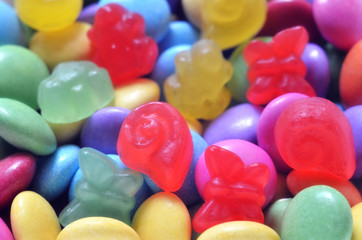 Fototapeta na wymiar Macro detail of pile of colored smarties and candy