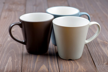 empty cups on wood background