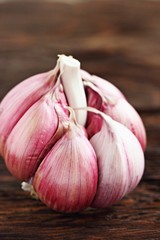Fresh garlic on a rustic wooden table.Selective focus.