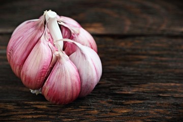 Fresh garlic on a rustic wooden table.Selective focus.