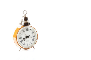 Vintage alarm clock isolated on white