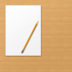 Sheet of office paper with yellow pencil on wooden background.