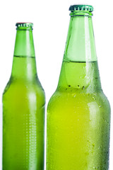 Two bottle with golden beer.