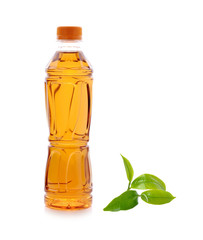 Bottle of green tea with tea leaf isolated on white background