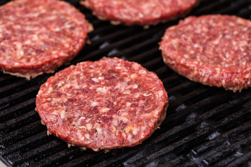 Preparing a batch of  grilled ground beef patties or frikadeller