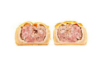 Pork pie isolated on a white studio background.