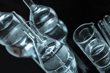 set of chemical glass vials with reflection